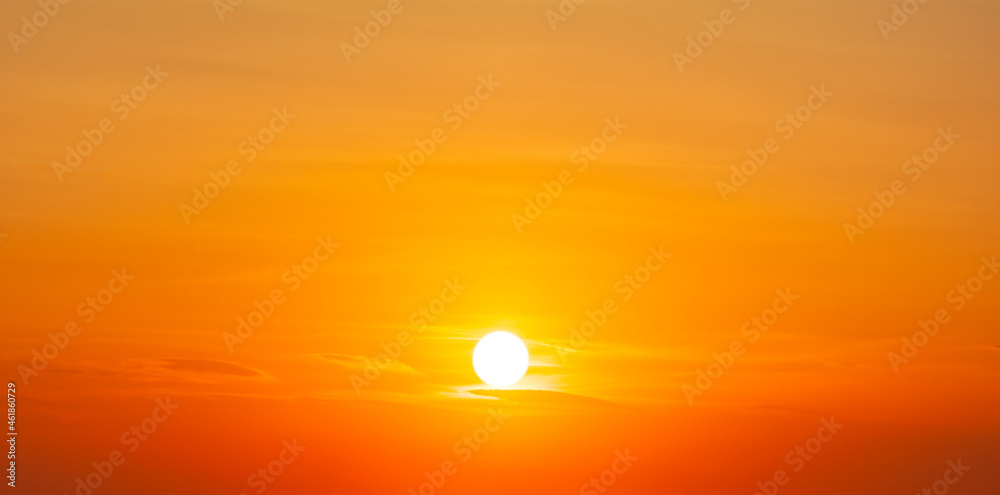 Setting sun in the orange sky. No land view.