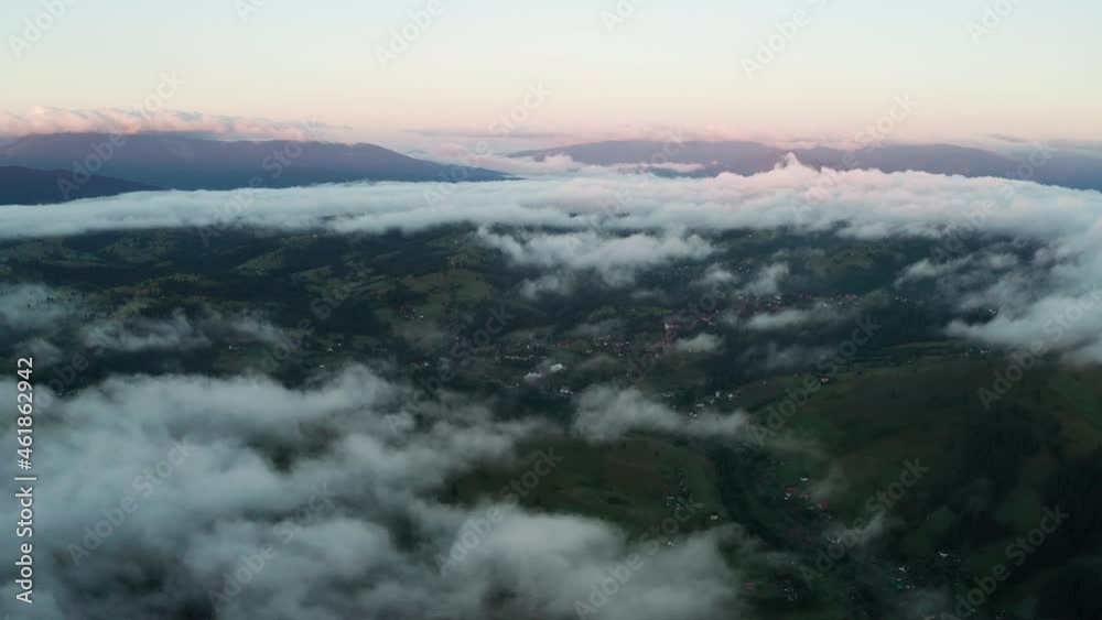 Aerial view of foggy sunrise in the mountains. Summer mountains. Aerial view of foggy sunrise in the mountains. Summer mountains.