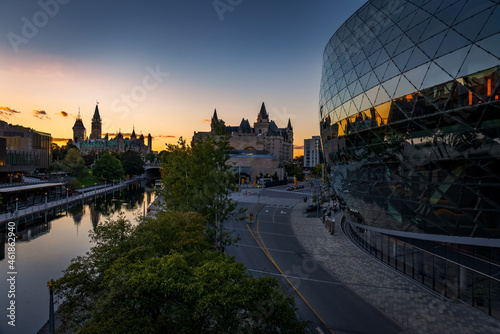 the Ottawa Convention Centre, at sunset, with Parliament and the Rideau Canal in the background photo