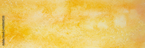 yellow watercolor with white spots. painted textured paper with watercolor paints of different orange color. background or backdrop of abstract art handmade diy painting