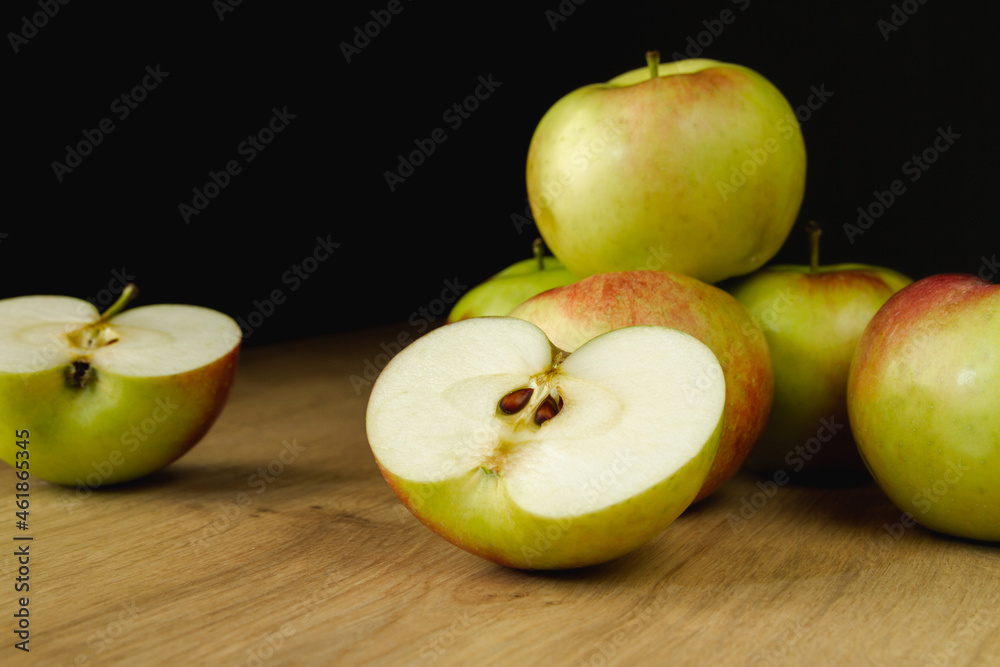 Fresh delicious apples on a wooden kitchen table. Healthy diet food fruits composition. Fresh delicious apples on a wooden kitchen table. Healthy diet food fruits composition.
