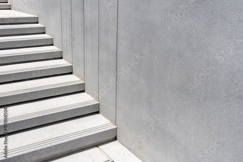 Outdoor step with white terrazo stone material.