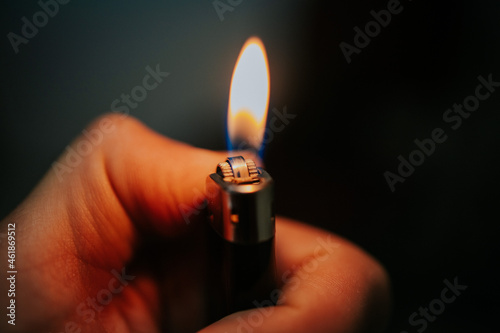Lighter in the persons hand photo