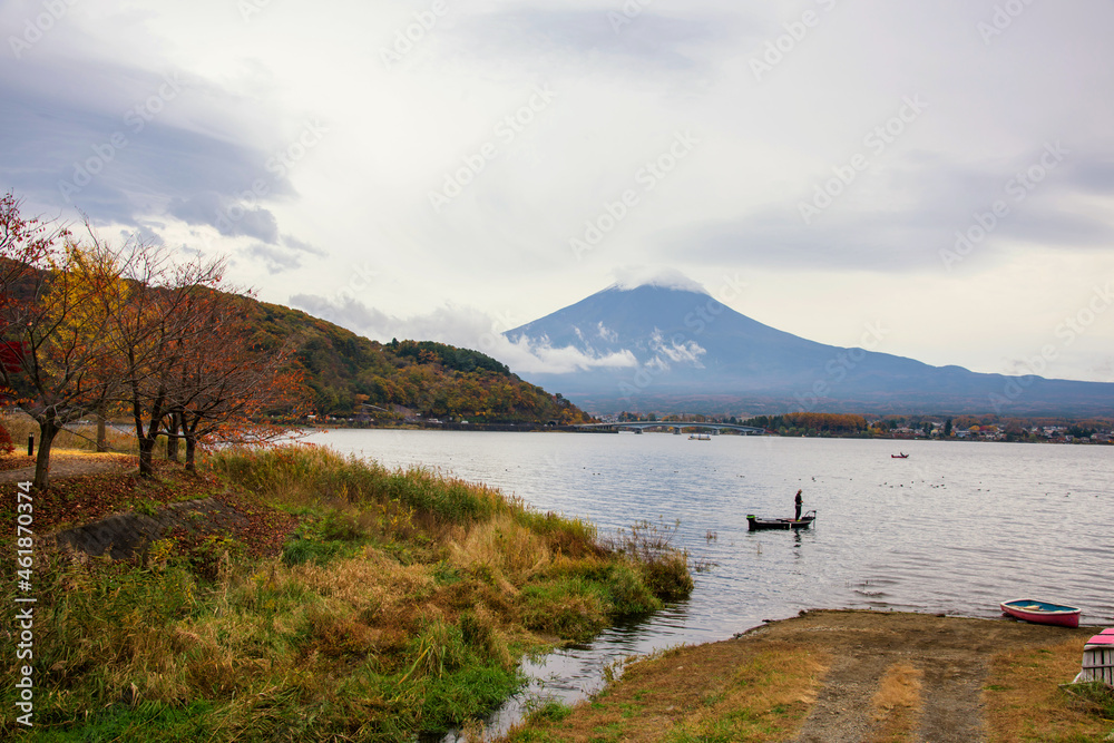 Fishing at Kawaguchiko lake with fuji in autumn