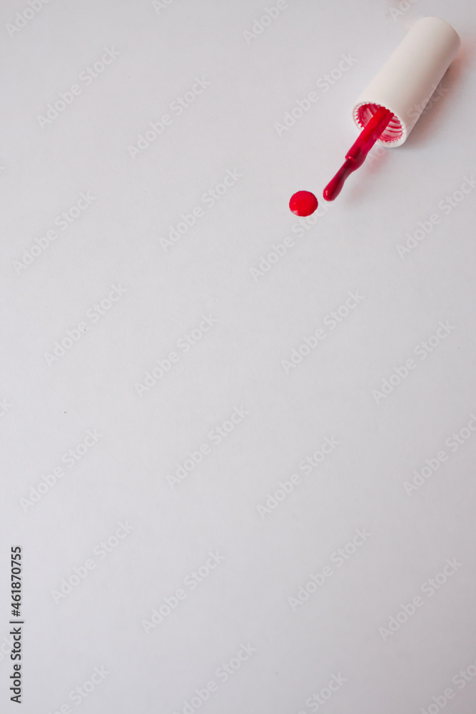white background with red drop of nail polish for beauty master records white background with red drop of nail polish for beauty master records
