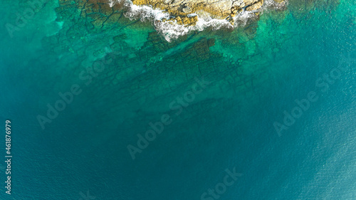 Underwater rocks in the crystal turquoise water, sea from above, aerial view.