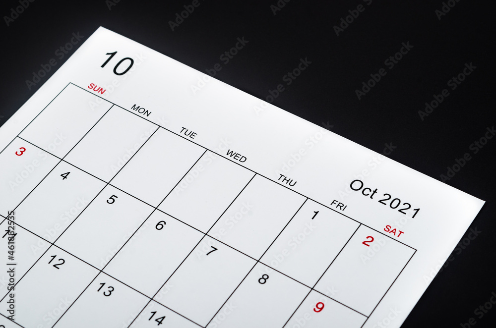 The October 2021 calendar sheet on black background.
