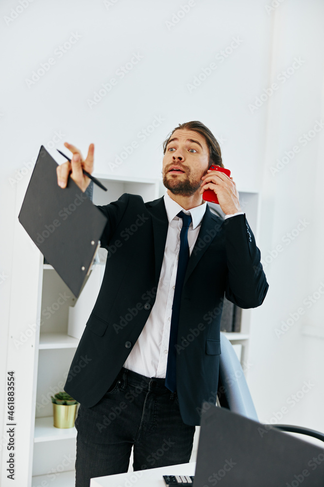 manager holding a phone telephone office technologies manager holding a phone telephone office technologies