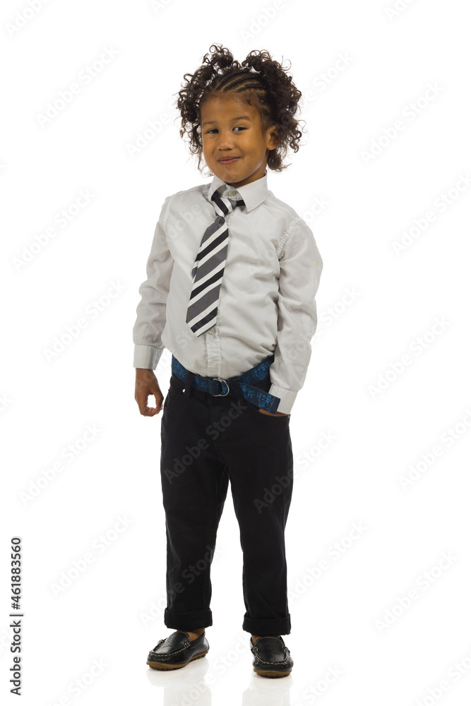 Small boy standing in elegant clothes and holding hand in pocket. Full length, isolated. Small boy standing in elegant clothes and holding hand in pocket. Full length, isolated.