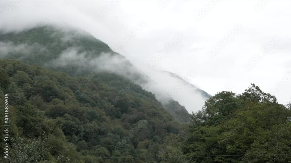 Amazing view of foggy mountain with green tropical forest. Landscape of rocks, autumn season nature Amazing view of foggy mountain with green tropical forest. Landscape of rocks, autumn season nature