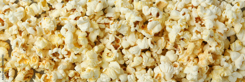 Tasty popcorn all over background, close up Tasty popcorn all over background, close up