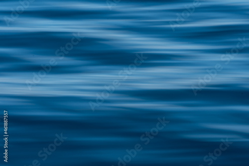 Dark blue hazy ocean ripples
