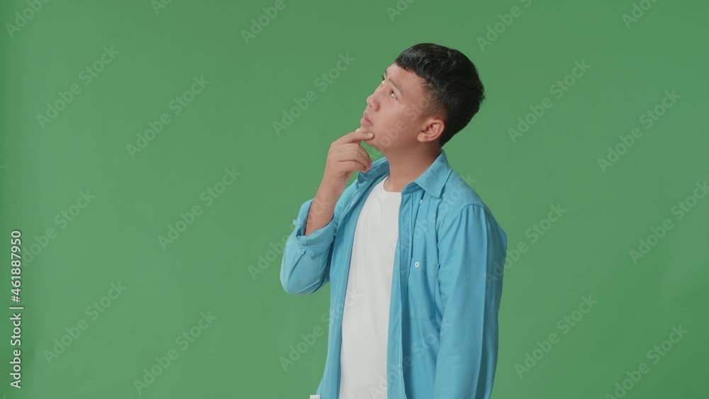 Side View Of Young Asian Boy Thinking About Something And Looking Around Then Raising His Index Finger And Eyes Wide Open While Standing On Green Screen In The Studio
Side View Of Young Asian Boy Thinking About Something And Looking Around Then Raising His Index Finger And Eyes Wide Open While Standing On Green Screen In The Studio