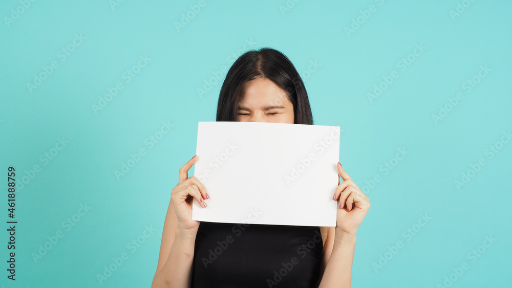 Blank empty paper in asian woman's hand on mint green or Tiffany Blue background. Blank empty paper in asian woman's hand on mint green or Tiffany Blue background.