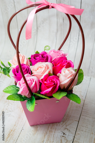 bouquet of pink roses,composition in a basket