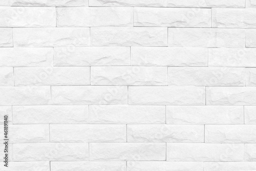 Seamless texture of white stone wall a rough surface, with space for text, for a background.