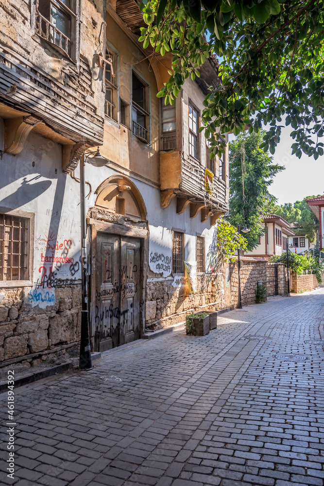 A traditional Turkish mansion and wooden gate in Antalya's historical Kaleici