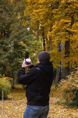 man taking pictures in the autumn forest © T-Iva
