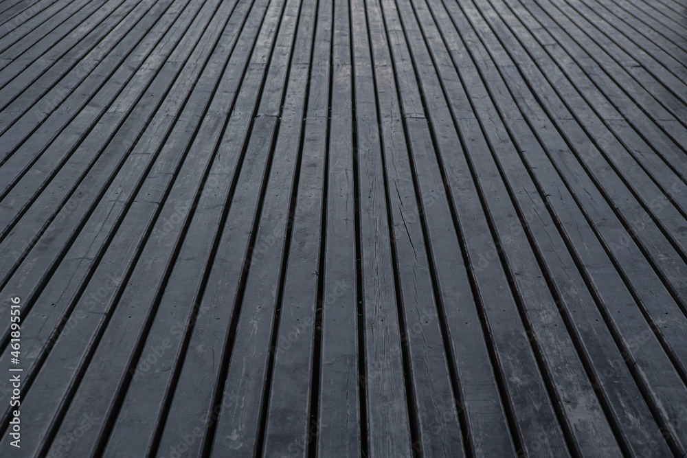 Wooden flooring from black painted boards Wooden flooring from black painted boards