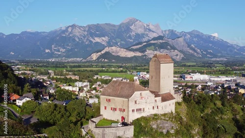 Aerial drone footage of the Sargans village and medieval hilltop fortress in Canton Sankt Gallen in eastern Switzerland. Shot with a rotation motion.  photo