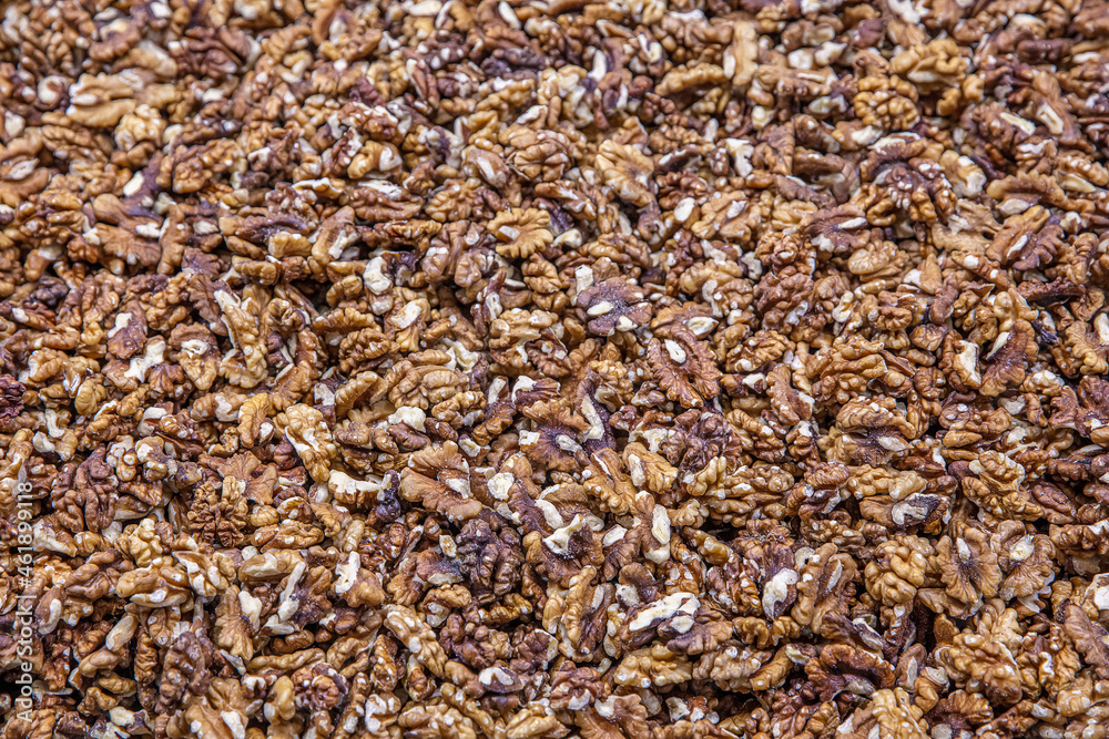 Walnuts are sorted for making baklava with walnuts. Walnuts without shells (filling the picture). Background of fresh walnuts.Walnuts background. Walnuts texture. Healthy food. Walnuts are sorted for making baklava with walnuts. Walnuts without shells (filling the picture). Background of fresh walnuts.Walnuts background. Walnuts texture. Healthy food.