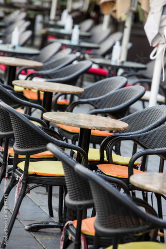 Empty chairs and tables at an open air terrace © bizoo_n