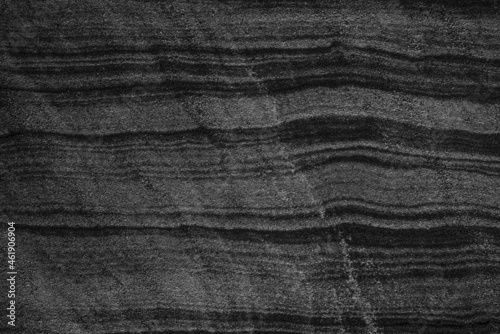 fond abstrait gris et noir de lignes horizontales et courbes.