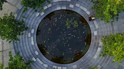 modern stylish park for recreation removed from a drone. fish swim in the water, a sharp soar up and the slender geometry of a new park after the pandemic with places to relax.