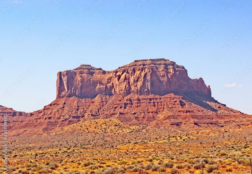 Fototapeta premium Large Rock Outcropping In Early Morning Rising Up High Desert Floor
