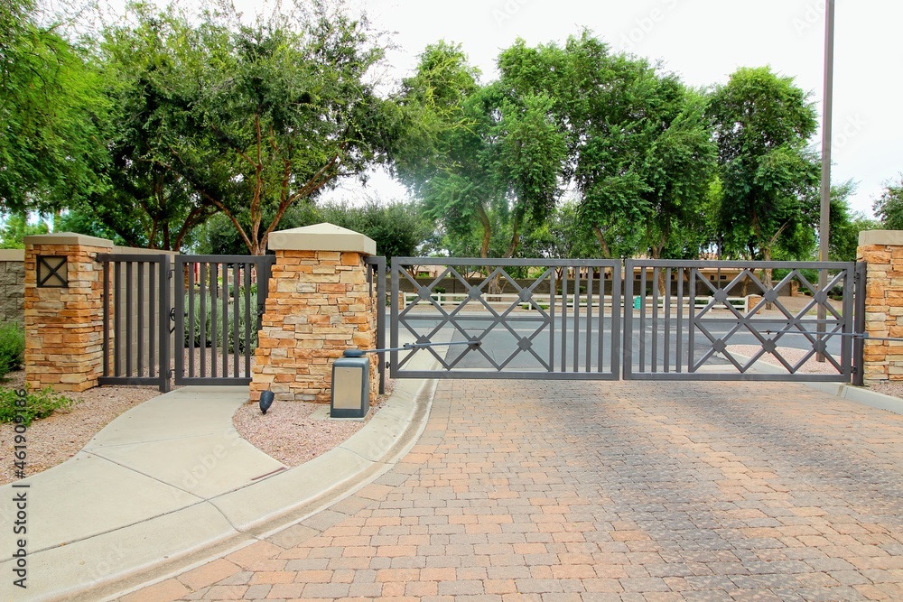 Metal Exit Gate With Flagstone Columns