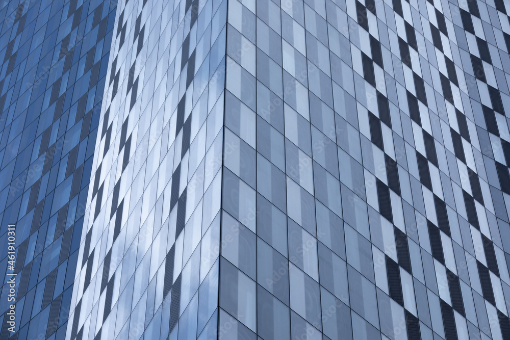 Close-up view of a modern glass building. Skyscraper. Architecture background. Close-up view of a modern glass building. Skyscraper. Architecture background.