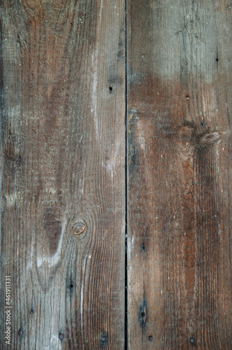 A wall of old rotten wooden planks. Natural raw planed texture . flat lay. Copy space.