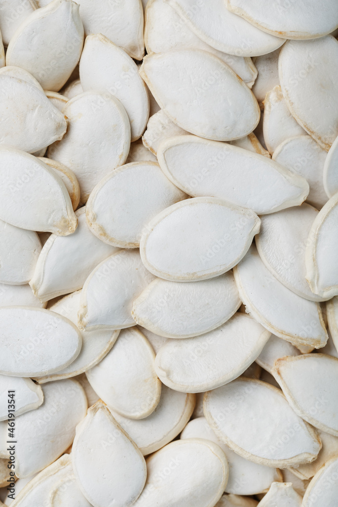 Pumpkin seeds in a shell as a textural background. Pumpkin seeds in a shell as a textural background.
