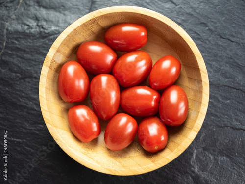 Pigeon heart cherry tomatoes, background. Flat lay, top view.