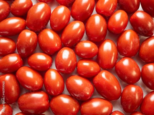 Pigeon heart cherry tomatoes, background. Flat lay, top view.