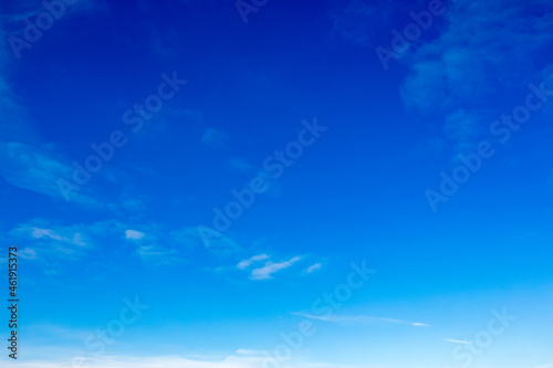 white fluffy clouds on a deep blue sky. sunny weather conditions