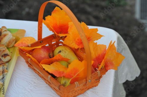 Apples and pears in autumn leaves