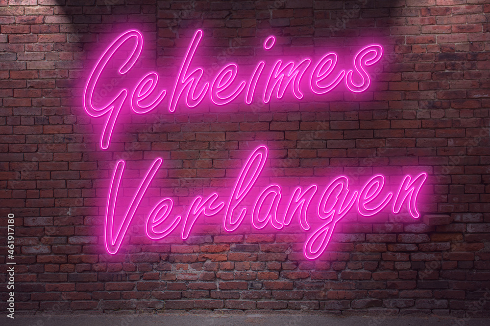 Neon secret desire (in german Geheimes Verlangen) lettering on Brick Wall at night