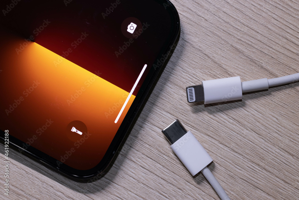 View of Apple Iphone 13 Pro Max with Lighting and Usb-c Cable Charger. EU  try to Forced Apple Iphone to Use Usb-c Instead of Lighting Cable in the  Nearly Future Stock Photo