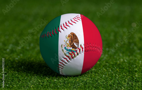 Baseball with Mexico flag on green grass background, close up photo