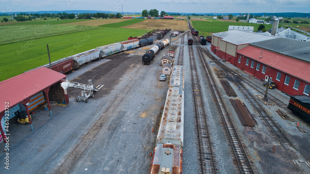 Aerial View of a Freight Yard With An Antique Steam Engine and Freight and Engine Shops
