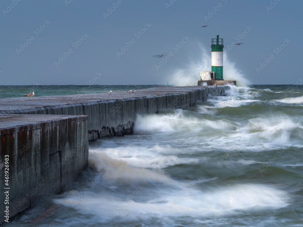 giant waves on lighthouse and pier in storm day giant waves on lighthouse and pier in storm day