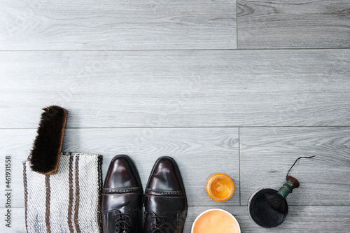 shoe cleaning area, wooden bottom with copy space, shoes, shoe grease, shoe polish, shoe cleaning supplies