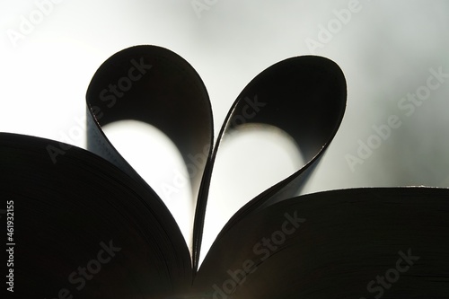 the pages of a book form the symbol of a heart. Concept of love for books and love for reading