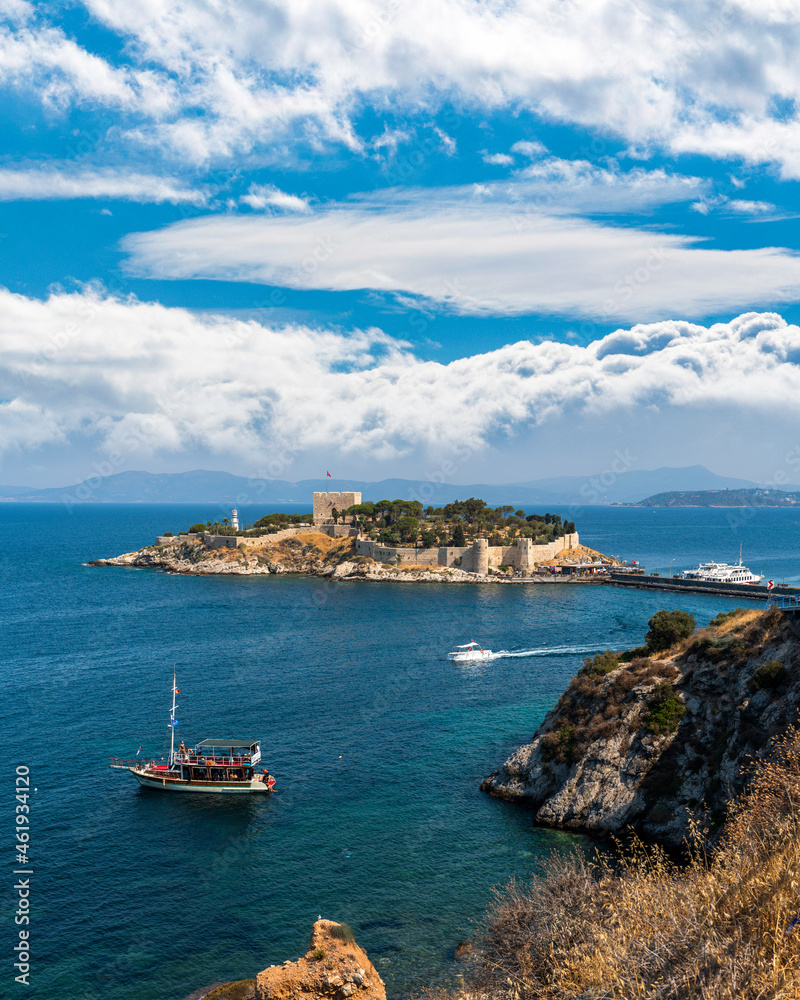 Kusadasi, Turkey - August 23, 2021: Pigeon Island Castle, (Guvercinada kalesi in Turkish) is a tourist attraction.