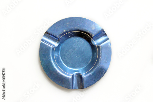 Vintage blue aluminum empty ashtray from above, isolated on a white background	
 photo