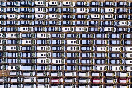 Aerial top-down view of vehicles in the parking lot. Car pattern background 