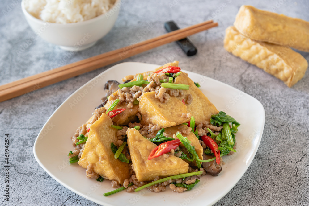 Stir fried tofu with vegetable, mushroom and chili with streamed rice, Chinese vegetarian food festival Stir fried tofu with vegetable, mushroom and chili with streamed rice, Chinese vegetarian food festival