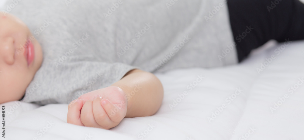 Portrait of asian little baby girl sleeping on bed in the bedroom at home, newborn napping with cozy and relax, infant innocence in bedtime, happy toddler cute, growth of child and emotion, indoors. Portrait of asian little baby girl sleeping on bed in the bedroom at home, newborn napping with cozy and relax, infant innocence in bedtime, happy toddler cute, growth of child and emotion, indoors.