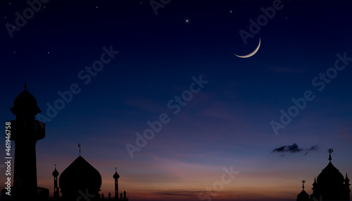 Silhouette mosque after sundown on dusk twilight sky with crescent moon star religion of Islamic 